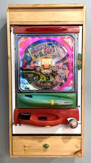 The machine powered on with additional lights and cabinet